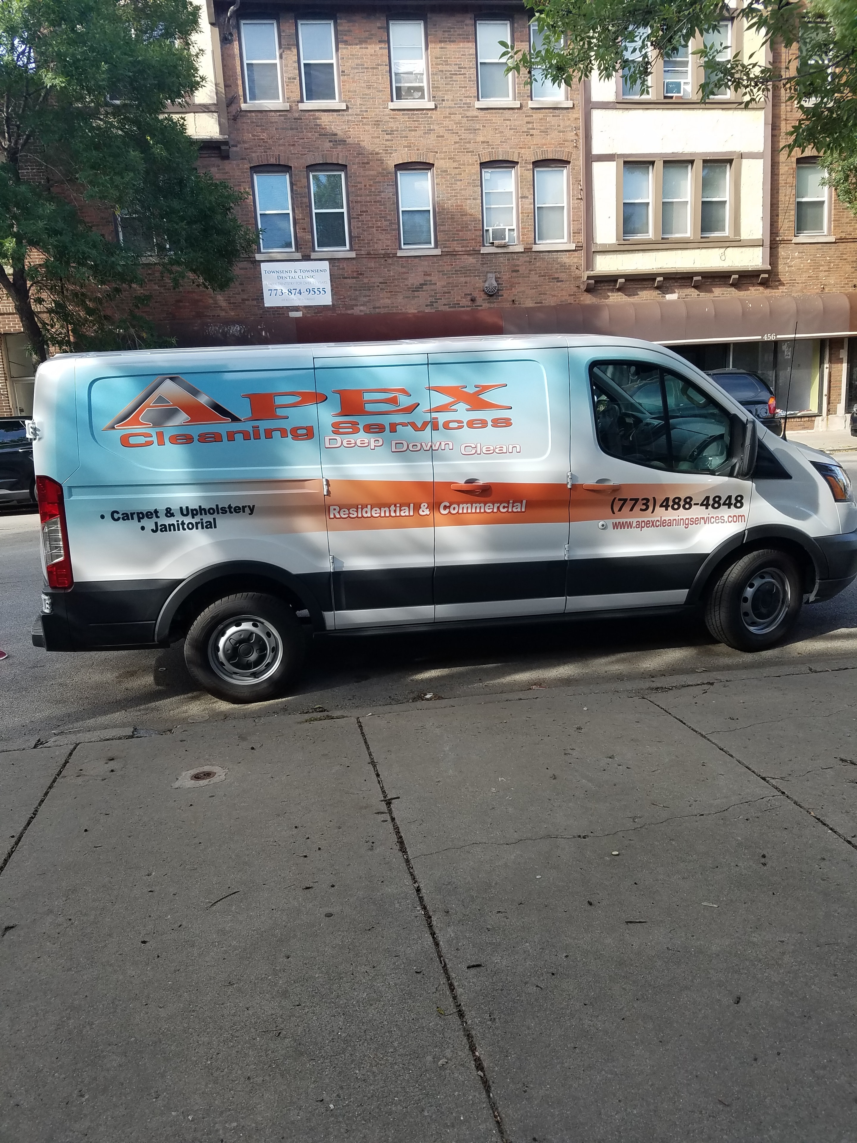 Apex Cleaning Services van on location in Chicago